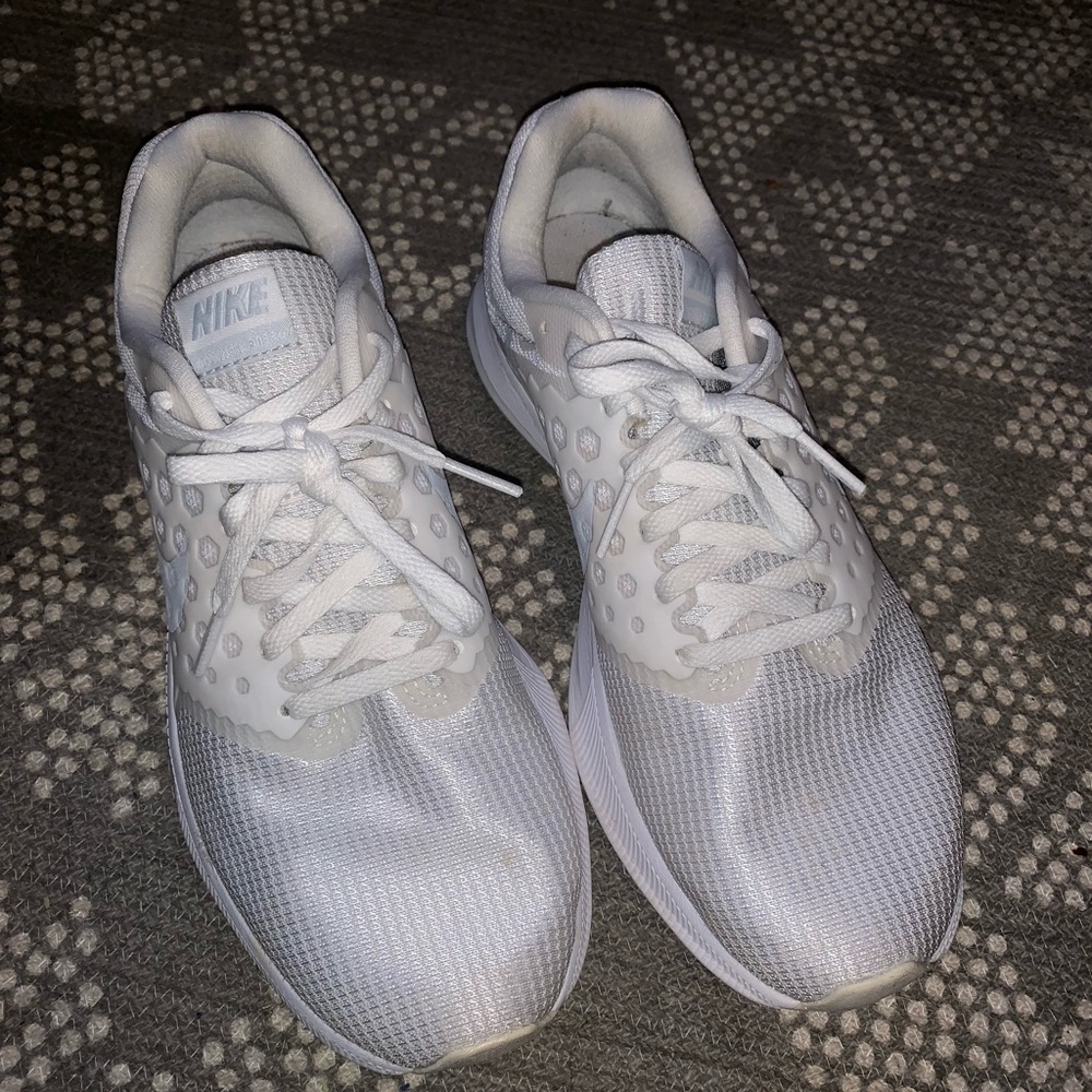 White Nike running shoes